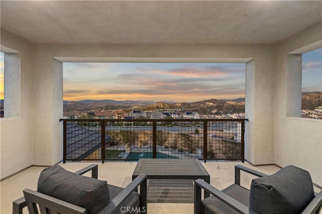 balcony at dusk with a mountain view