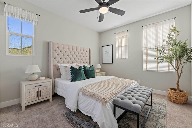 bedroom featuring carpet floors, baseboards, and a ceiling fan