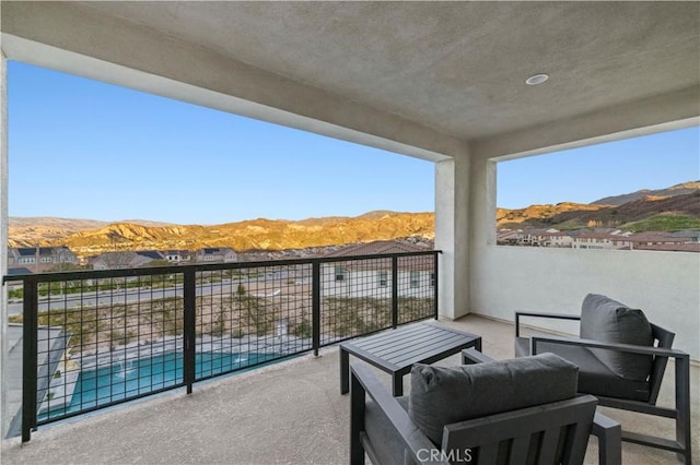 balcony featuring outdoor lounge area and a mountain view