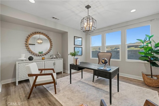 office space with a chandelier, recessed lighting, visible vents, baseboards, and light wood-style floors