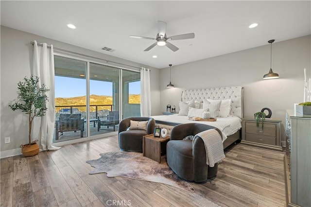 bedroom featuring baseboards, visible vents, wood finished floors, access to exterior, and recessed lighting