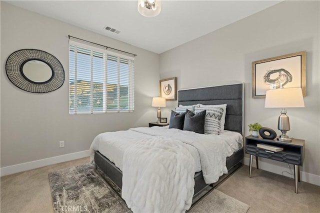 bedroom featuring baseboards, visible vents, and carpet flooring