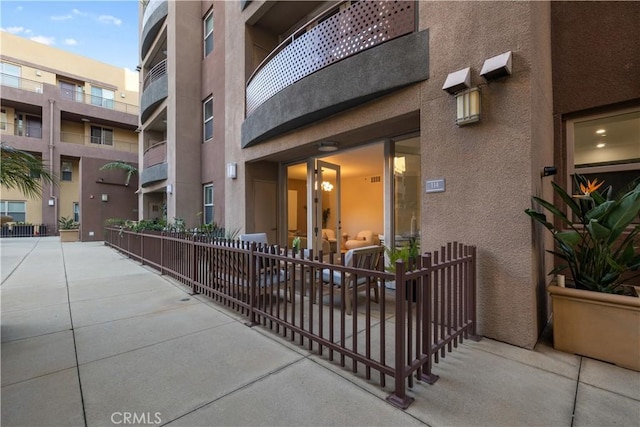 property entrance featuring stucco siding