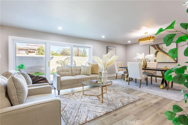 living area with wood finished floors and recessed lighting