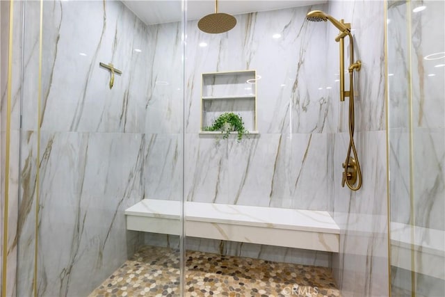 full bath featuring a marble finish shower