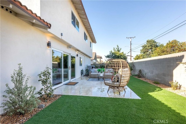 view of yard with outdoor lounge area, a patio area, and a fenced backyard