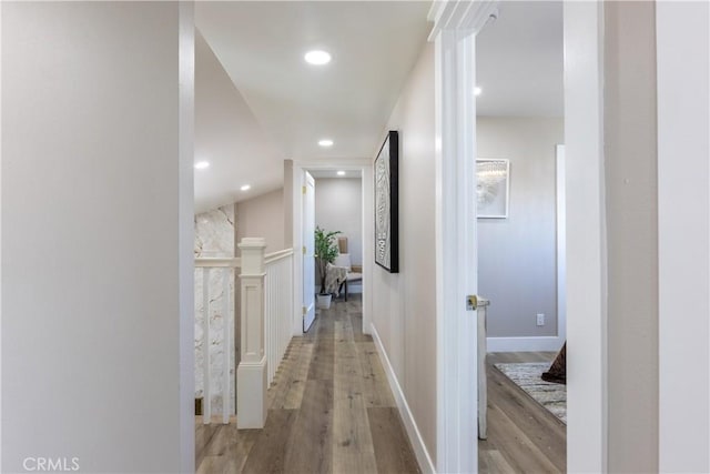 hallway featuring light wood-style floors and recessed lighting