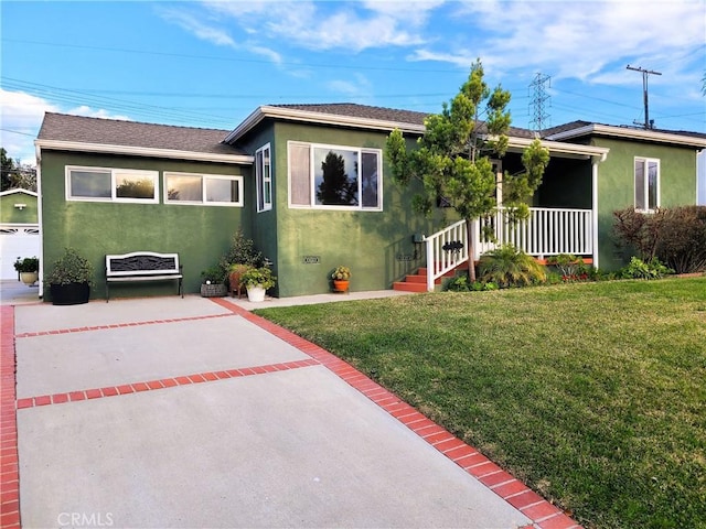 view of front of property with roof with shingles, stucco siding, covered porch, crawl space, and a front lawn