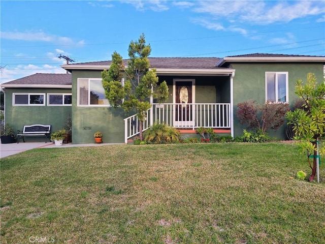 ranch-style house with a front lawn and stucco siding