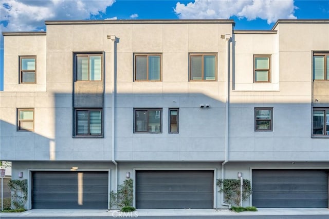 exterior space featuring driveway and a garage