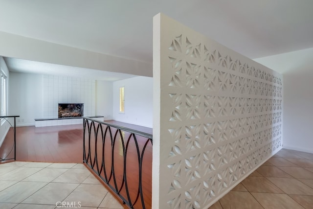 hall featuring light tile patterned floors