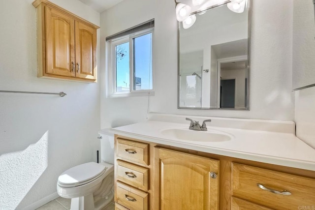 bathroom featuring toilet and vanity