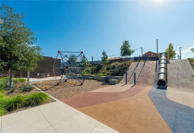 view of jungle gym featuring a patio area