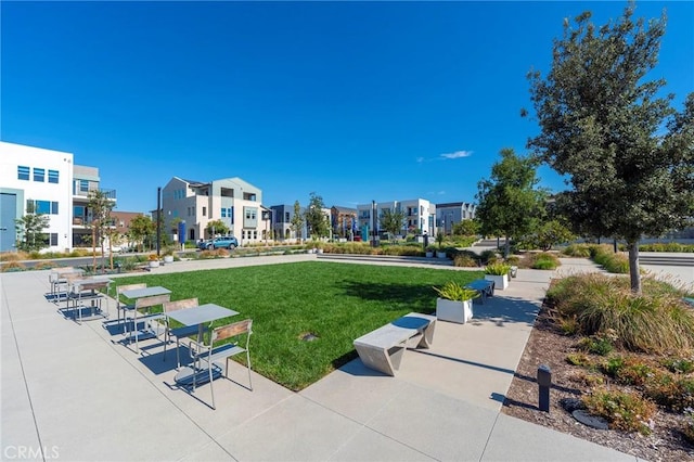 view of home's community with a lawn