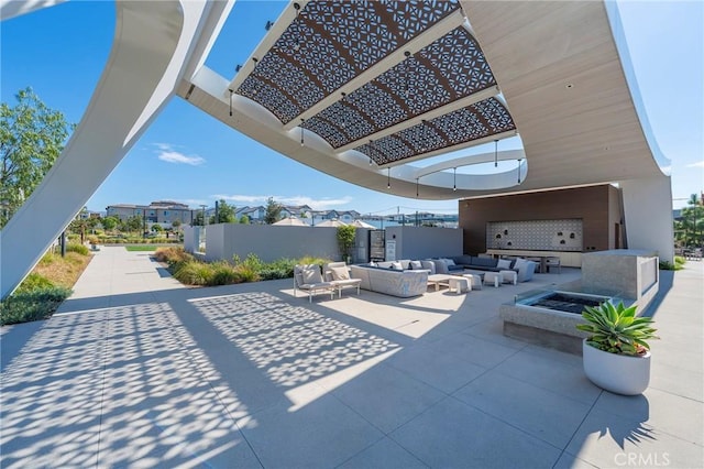 view of patio with fence and an outdoor living space