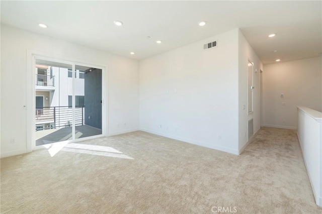 carpeted empty room with recessed lighting, visible vents, and baseboards