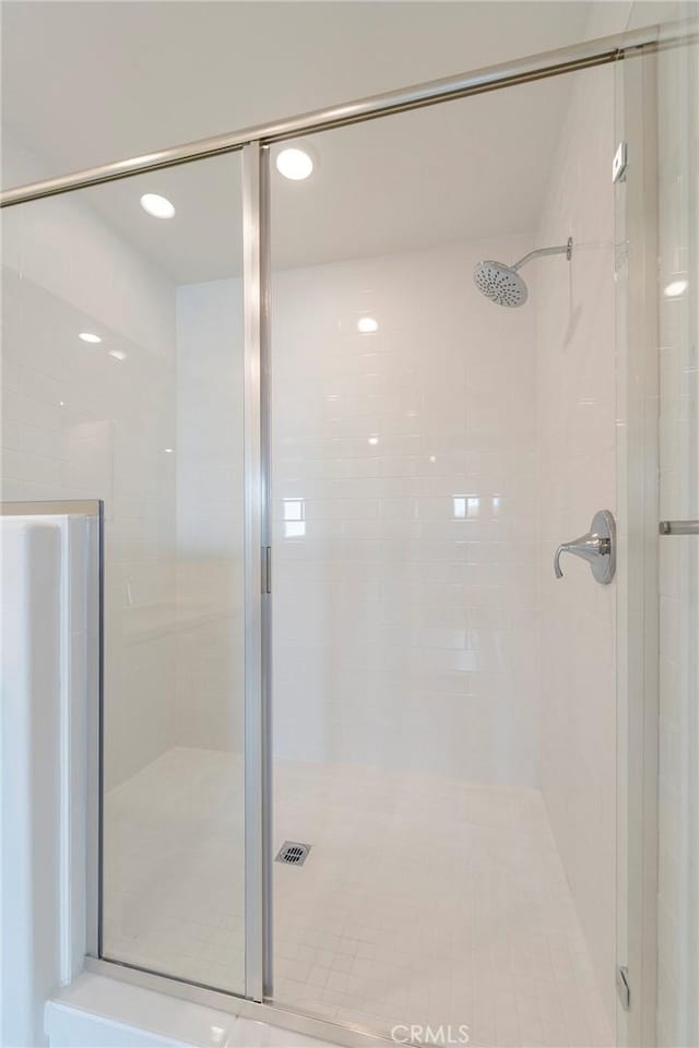 full bath featuring a shower stall