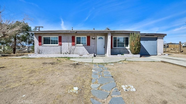 single story home featuring stucco siding