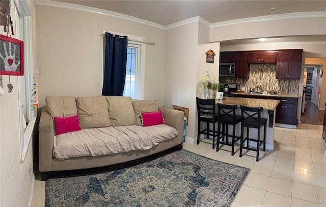 living room featuring light tile patterned floors and ornamental molding