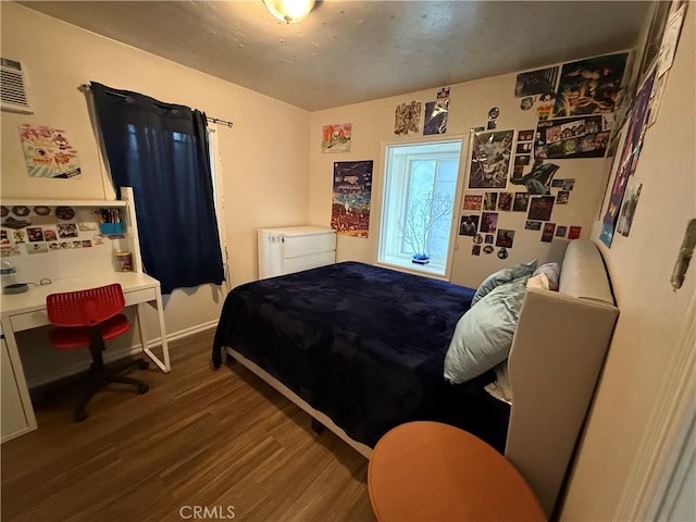 bedroom featuring wood finished floors