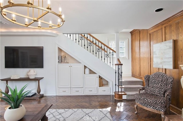 living area with stairway and baseboards