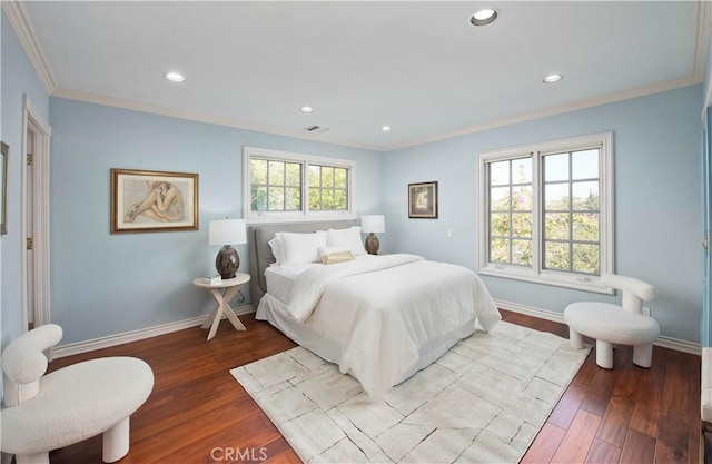 bedroom featuring crown molding, recessed lighting, visible vents, wood finished floors, and baseboards