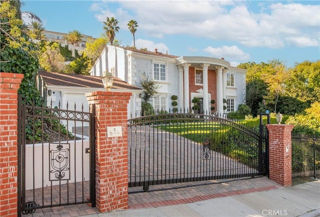 view of gate with fence