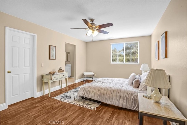 bedroom with a ceiling fan, baseboards, and wood finished floors