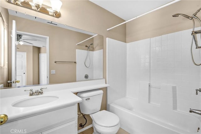 full bathroom featuring visible vents, a ceiling fan, toilet,  shower combination, and vanity