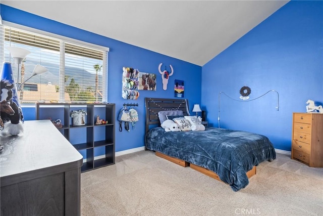 bedroom featuring vaulted ceiling, carpet flooring, and baseboards