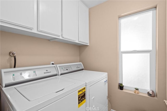 laundry room featuring cabinet space and washing machine and dryer