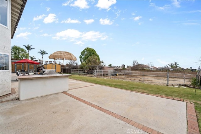 view of patio / terrace with an outbuilding