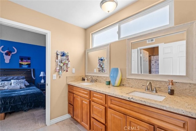 full bathroom with double vanity, ensuite bath, visible vents, and a sink