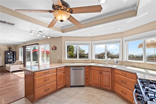 kitchen featuring visible vents, range with gas cooktop, a sink, dishwasher, and crown molding