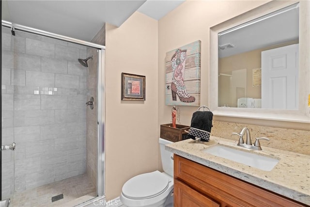 full bath featuring visible vents, toilet, a stall shower, and vanity