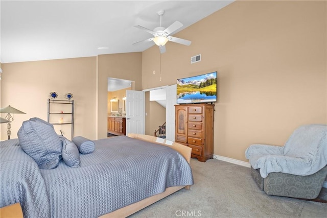 carpeted bedroom featuring visible vents, connected bathroom, baseboards, high vaulted ceiling, and a ceiling fan