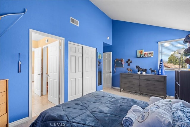 carpeted bedroom featuring a closet, visible vents, high vaulted ceiling, and baseboards