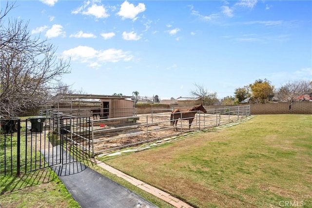 view of yard with an exterior structure and an outbuilding