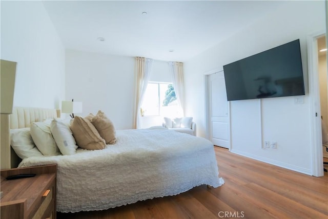 bedroom with wood finished floors