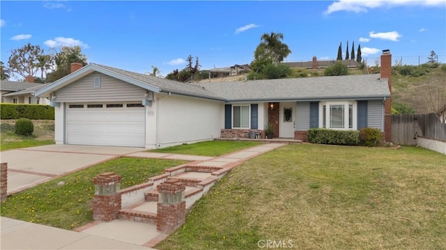 ranch-style house featuring an attached garage, a shingled roof, fence, concrete driveway, and a front lawn