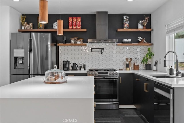 kitchen featuring wall chimney exhaust hood, stainless steel appliances, light countertops, open shelves, and a sink