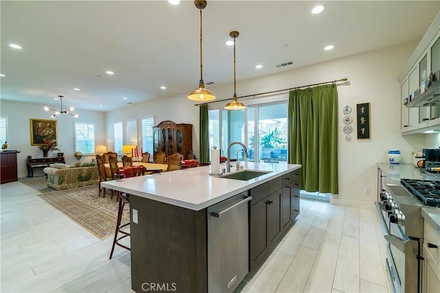 kitchen with visible vents, appliances with stainless steel finishes, light countertops, a sink, and recessed lighting