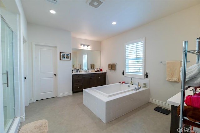 full bath featuring a stall shower, tile patterned flooring, vanity, a bath, and recessed lighting