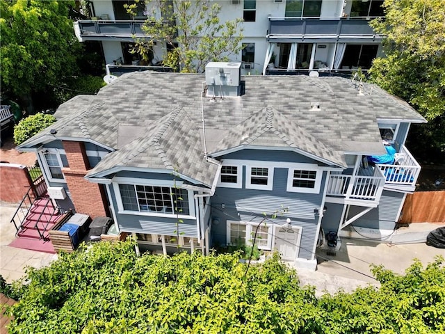 1204 N Clark St, West Hollywood, CA 90069 - back of house featuring roof with shingles and a balcony