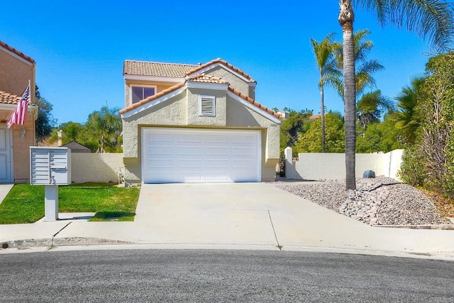 view of front of house featuring fence, driveway, a tiled roof, and stucco siding