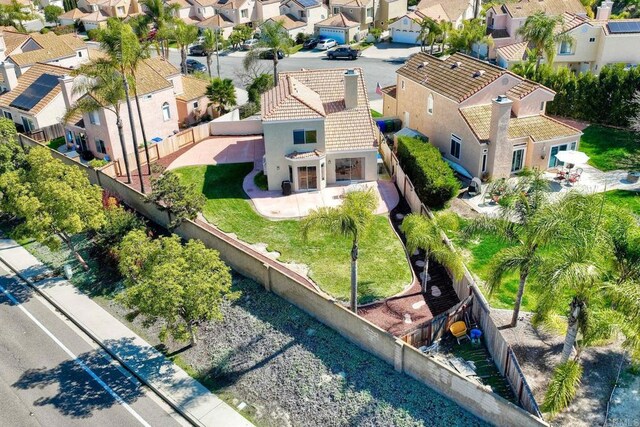 birds eye view of property with a residential view