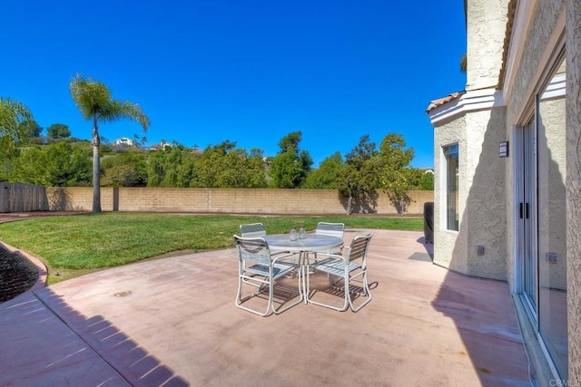 view of patio / terrace featuring outdoor dining space and a fenced backyard