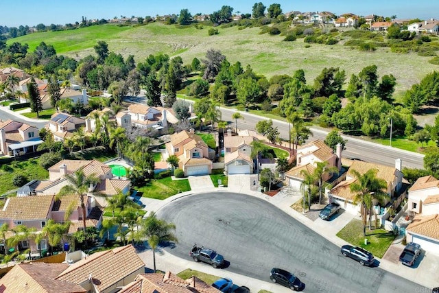 birds eye view of property with a residential view