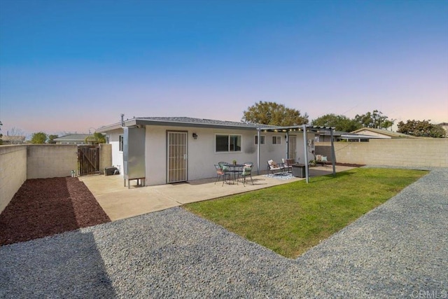 3735 Budd St, San Diego, CA 92111 - rear view of house featuring a gate, a patio, fence private yard, stucco siding, and a yard