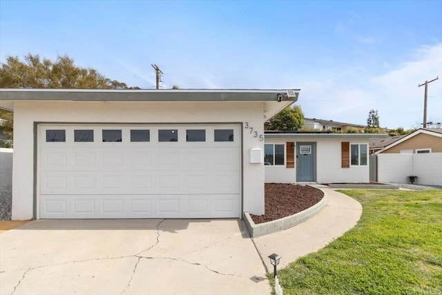 3735 Budd St, San Diego, CA 92111 - view of front facade featuring a front lawn, driveway, stucco siding, and a garage